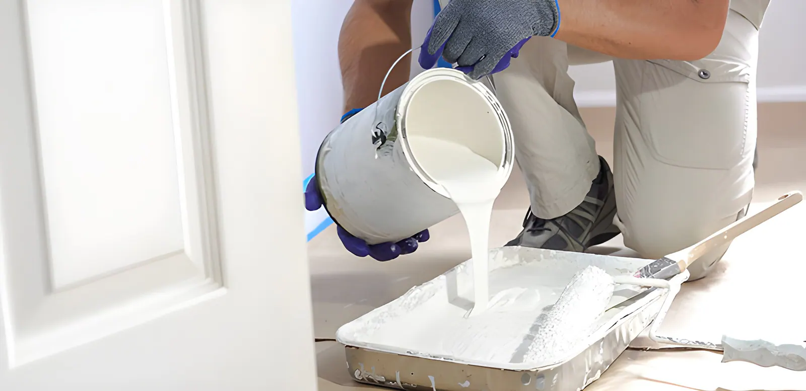 Mise en peinture des murs intérieurs d'une maison à Isques